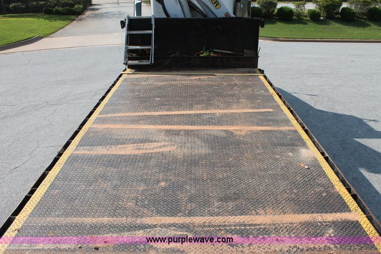 image for item I7757 2002 Freightliner FLD120SD triple axle semi truck with Palfinger knuckle boom crane