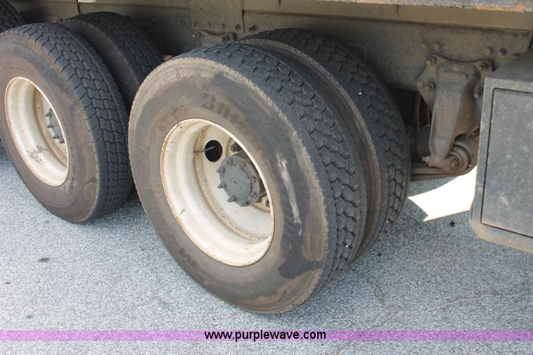 image for item I7757 2002 Freightliner FLD120SD triple axle semi truck with Palfinger knuckle boom crane