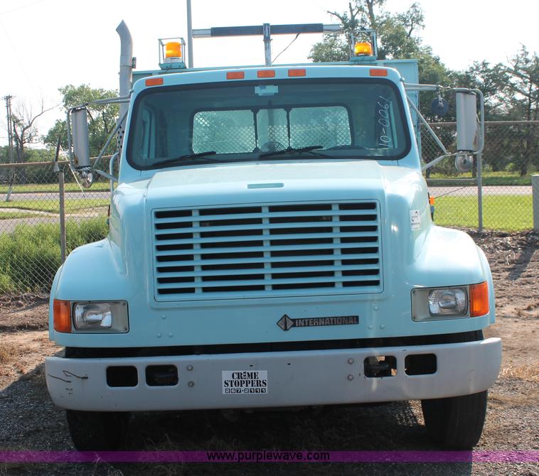 image for item I8245 2000 International 4700 Lo-Profile flatbed/crane body truck