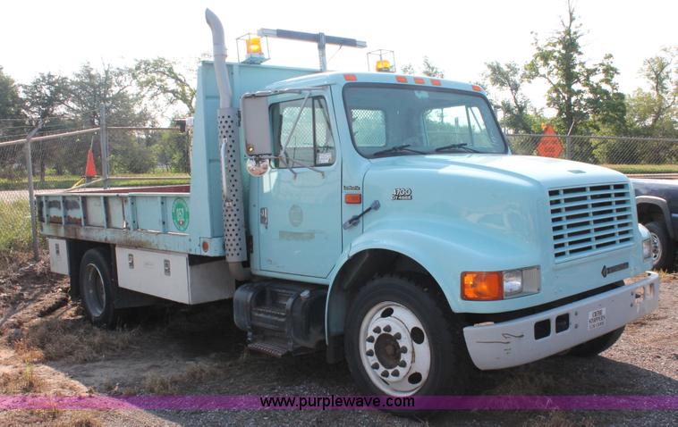 image for item I8245 2000 International 4700 Lo-Profile flatbed/crane body truck