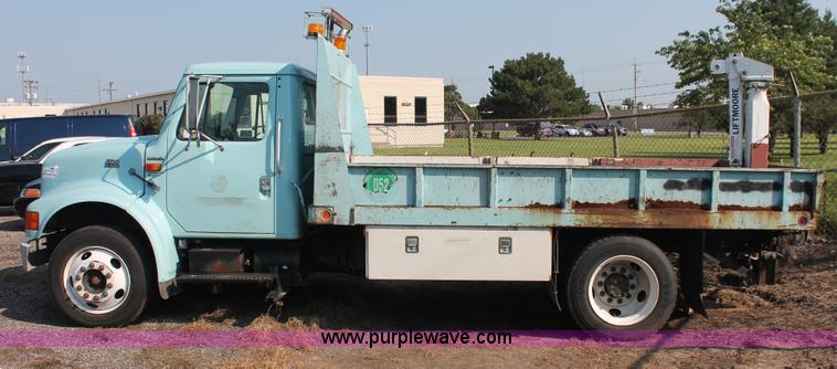 image for item I8245 2000 International 4700 Lo-Profile flatbed/crane body truck