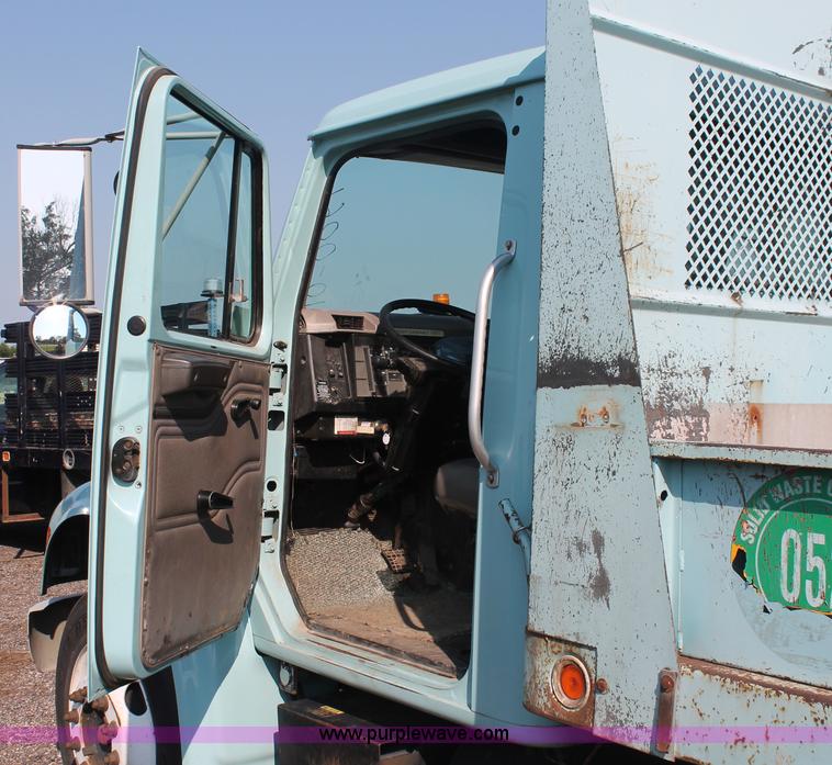 image for item I8245 2000 International 4700 Lo-Profile flatbed/crane body truck