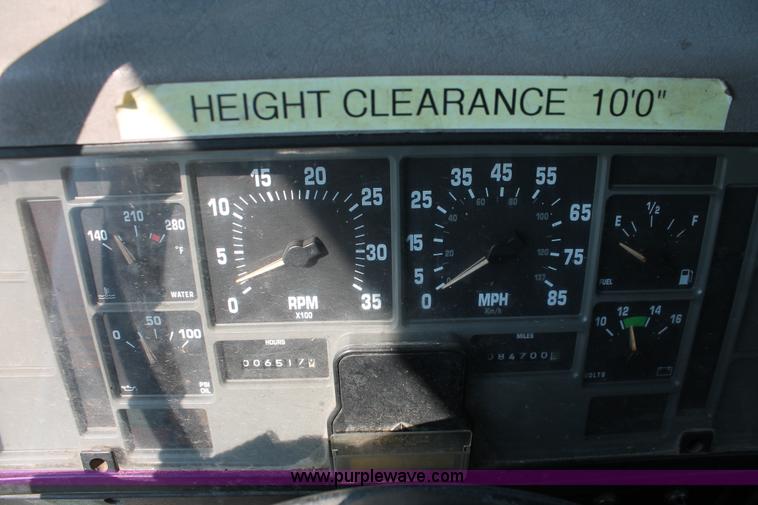 image for item I8245 2000 International 4700 Lo-Profile flatbed/crane body truck