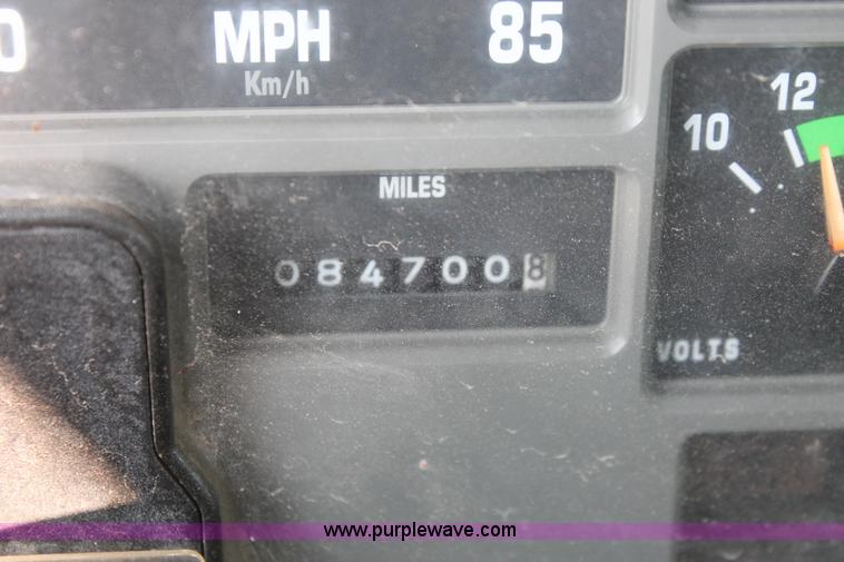 image for item I8245 2000 International 4700 Lo-Profile flatbed/crane body truck