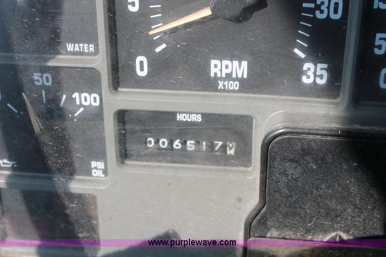 image for item I8245 2000 International 4700 Lo-Profile flatbed/crane body truck