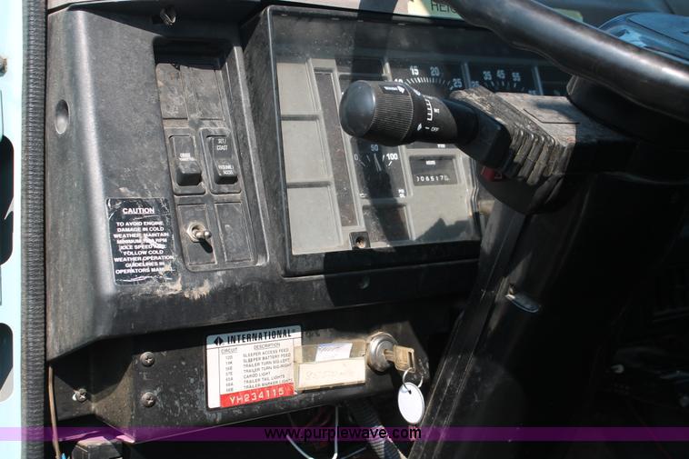 image for item I8245 2000 International 4700 Lo-Profile flatbed/crane body truck