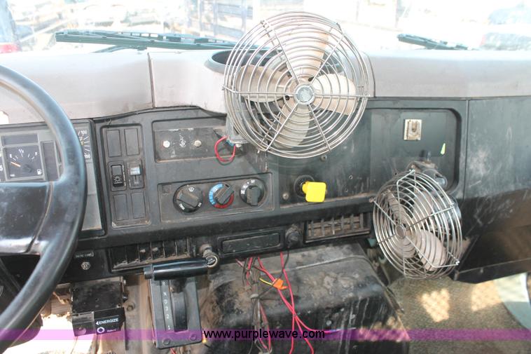 image for item I8245 2000 International 4700 Lo-Profile flatbed/crane body truck