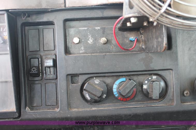 image for item I8245 2000 International 4700 Lo-Profile flatbed/crane body truck