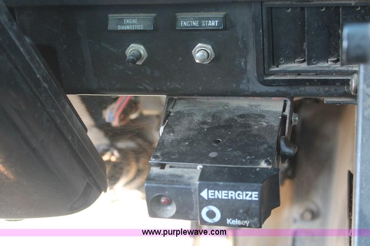 image for item I8245 2000 International 4700 Lo-Profile flatbed/crane body truck