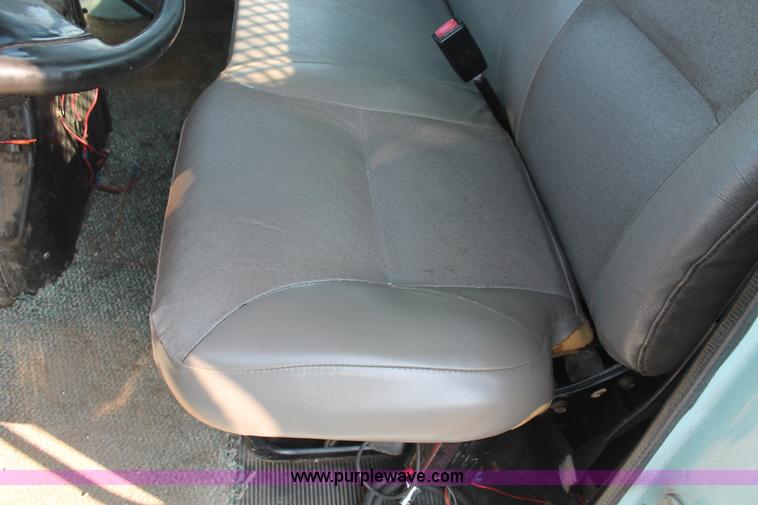 image for item I8245 2000 International 4700 Lo-Profile flatbed/crane body truck