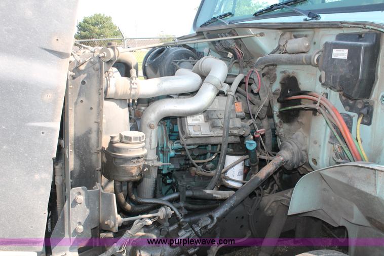 image for item I8245 2000 International 4700 Lo-Profile flatbed/crane body truck