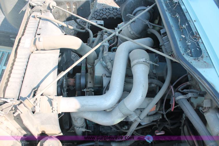 image for item I8245 2000 International 4700 Lo-Profile flatbed/crane body truck