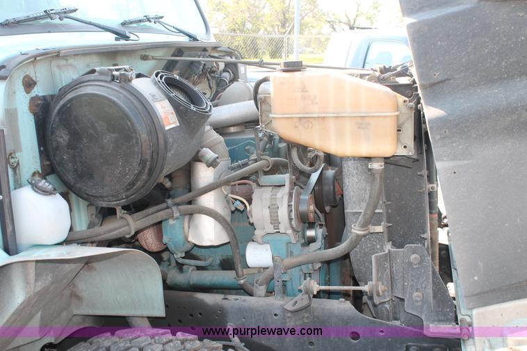 image for item I8245 2000 International 4700 Lo-Profile flatbed/crane body truck