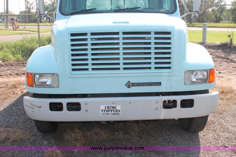 image for item I8245 2000 International 4700 Lo-Profile flatbed/crane body truck