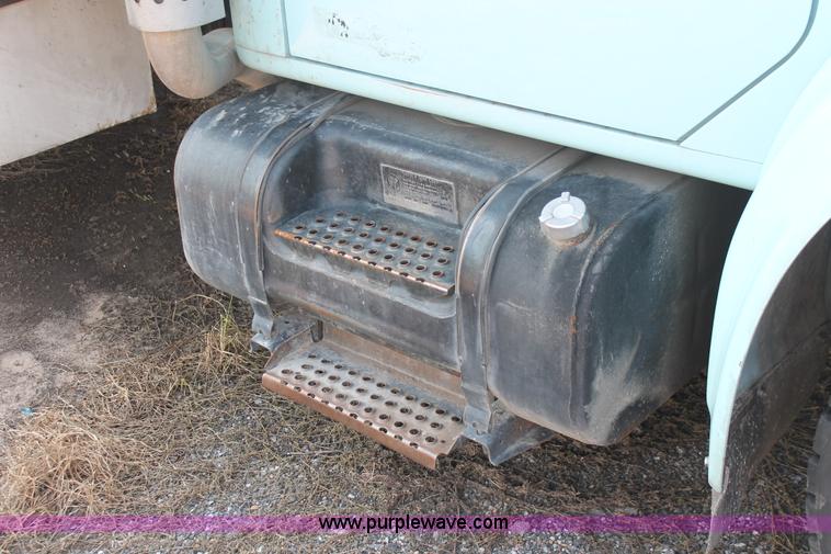 image for item I8245 2000 International 4700 Lo-Profile flatbed/crane body truck