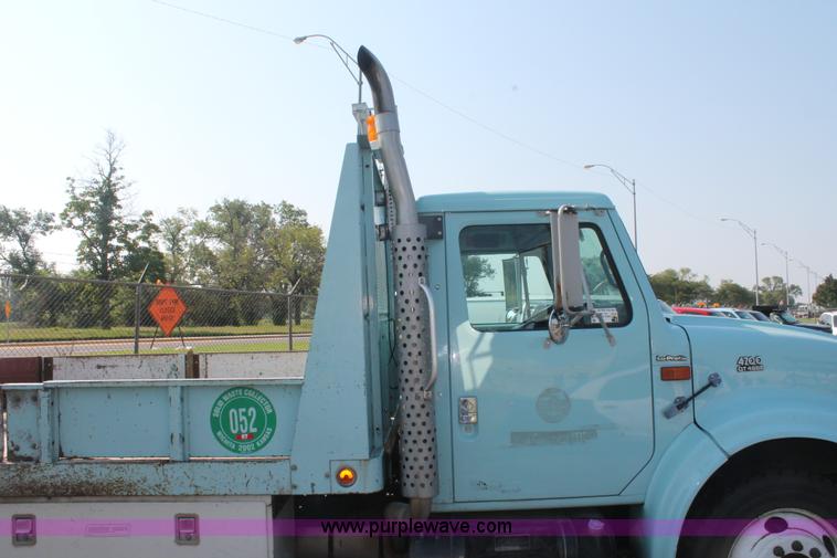 image for item I8245 2000 International 4700 Lo-Profile flatbed/crane body truck
