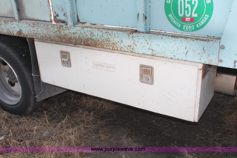 image for item I8245 2000 International 4700 Lo-Profile flatbed/crane body truck