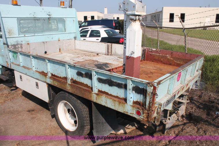 image for item I8245 2000 International 4700 Lo-Profile flatbed/crane body truck
