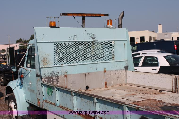 image for item I8245 2000 International 4700 Lo-Profile flatbed/crane body truck