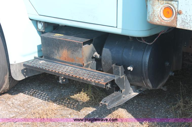 image for item I8245 2000 International 4700 Lo-Profile flatbed/crane body truck