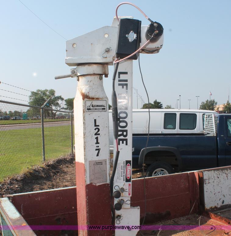 image for item I8245 2000 International 4700 Lo-Profile flatbed/crane body truck