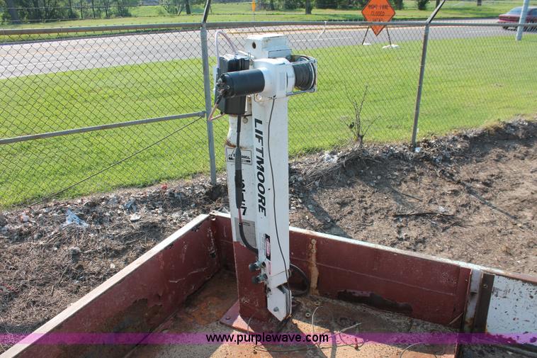 image for item I8245 2000 International 4700 Lo-Profile flatbed/crane body truck