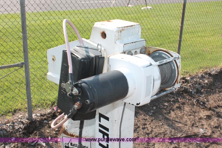 image for item I8245 2000 International 4700 Lo-Profile flatbed/crane body truck