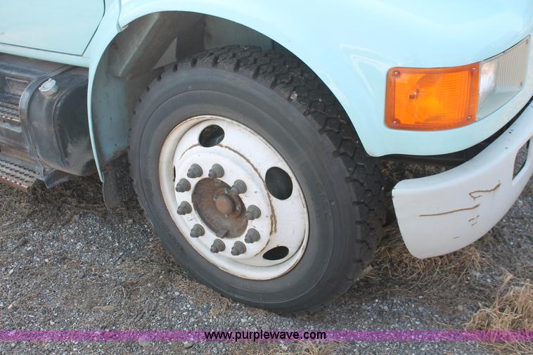 image for item I8245 2000 International 4700 Lo-Profile flatbed/crane body truck