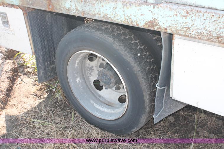 image for item I8245 2000 International 4700 Lo-Profile flatbed/crane body truck