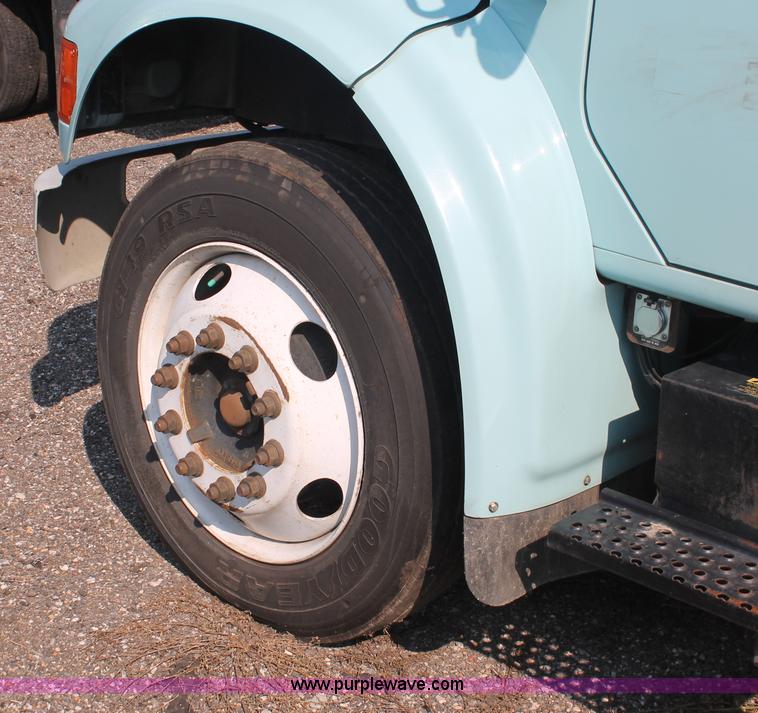 image for item I8245 2000 International 4700 Lo-Profile flatbed/crane body truck