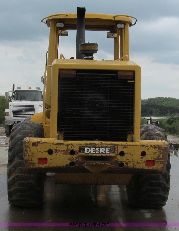 image for item E3937 1999 John Deere 624H loader