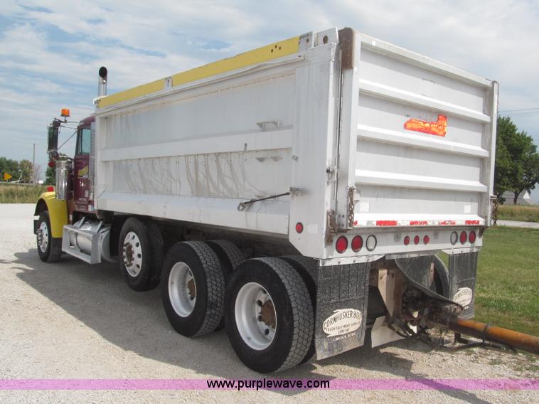 image for item F7111 2000 Freightliner FLD120SD tri axle dump truck