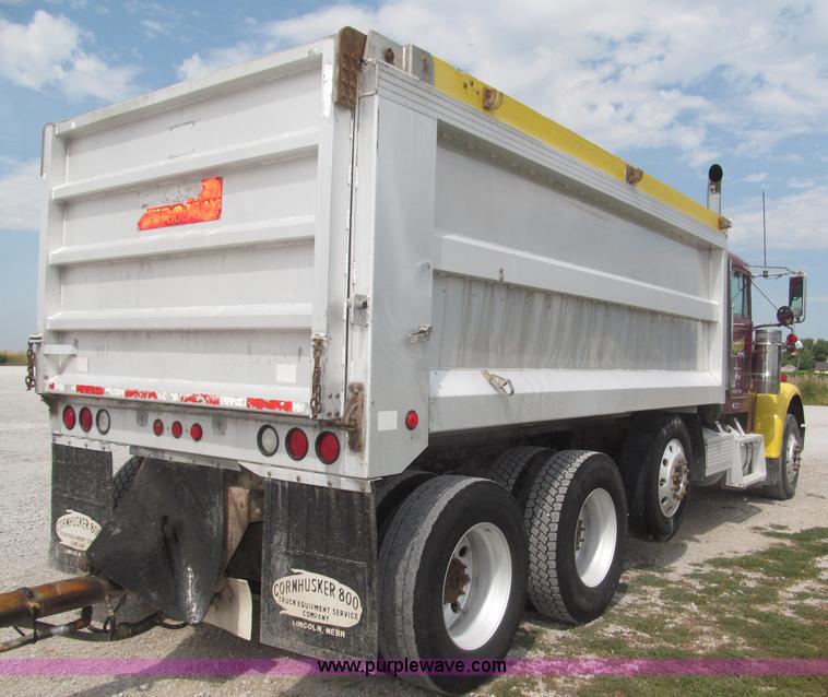 image for item F7111 2000 Freightliner FLD120SD tri axle dump truck
