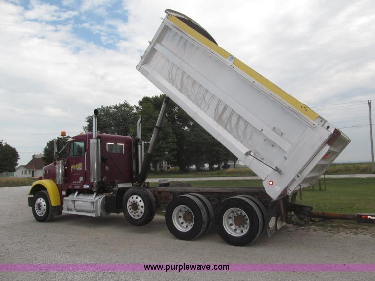 image for item F7111 2000 Freightliner FLD120SD tri axle dump truck