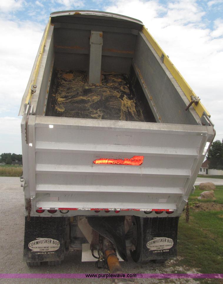 image for item F7111 2000 Freightliner FLD120SD tri axle dump truck