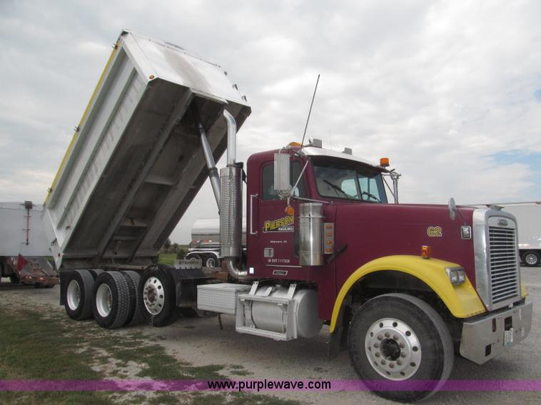 image for item F7111 2000 Freightliner FLD120SD tri axle dump truck