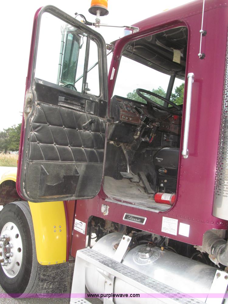 image for item F7111 2000 Freightliner FLD120SD tri axle dump truck