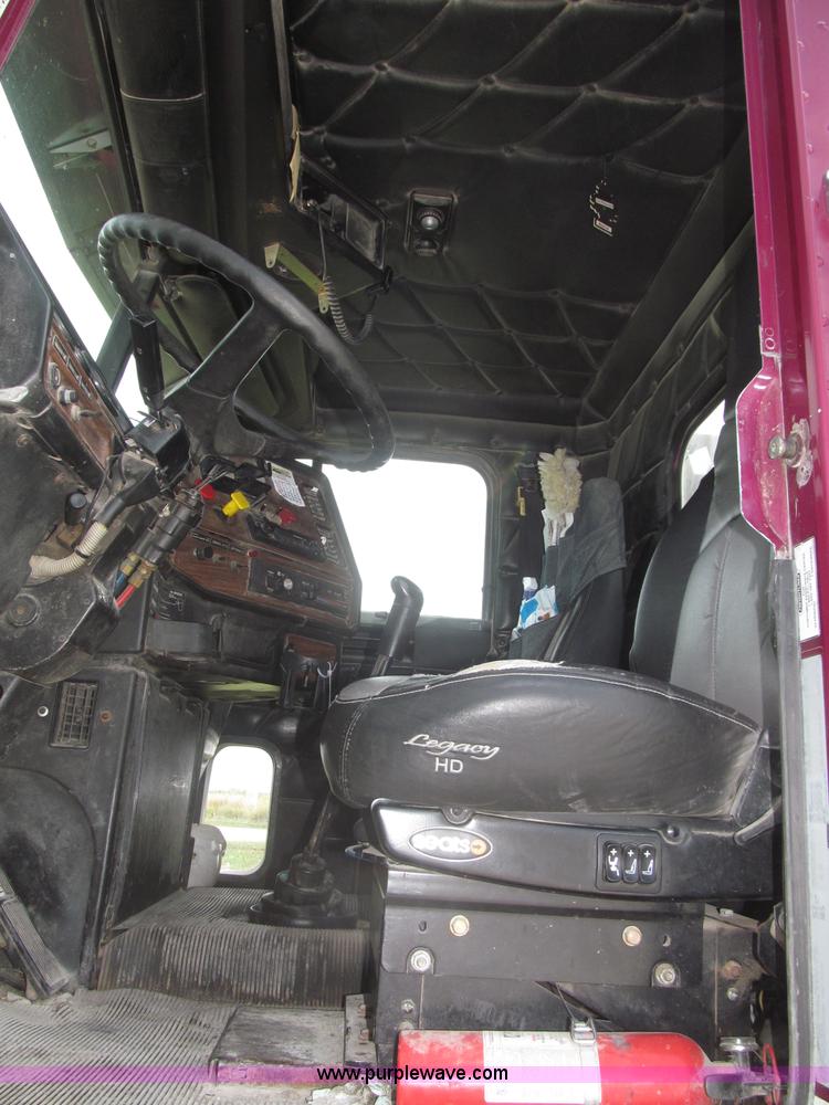 image for item F7111 2000 Freightliner FLD120SD tri axle dump truck