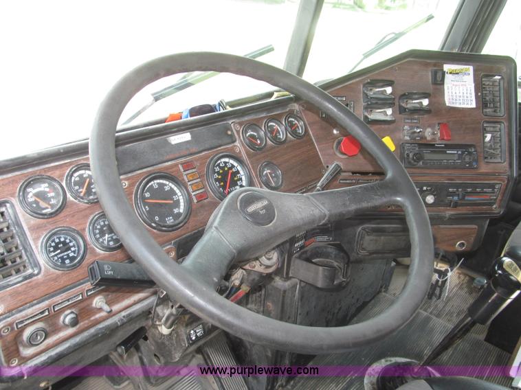 image for item F7111 2000 Freightliner FLD120SD tri axle dump truck