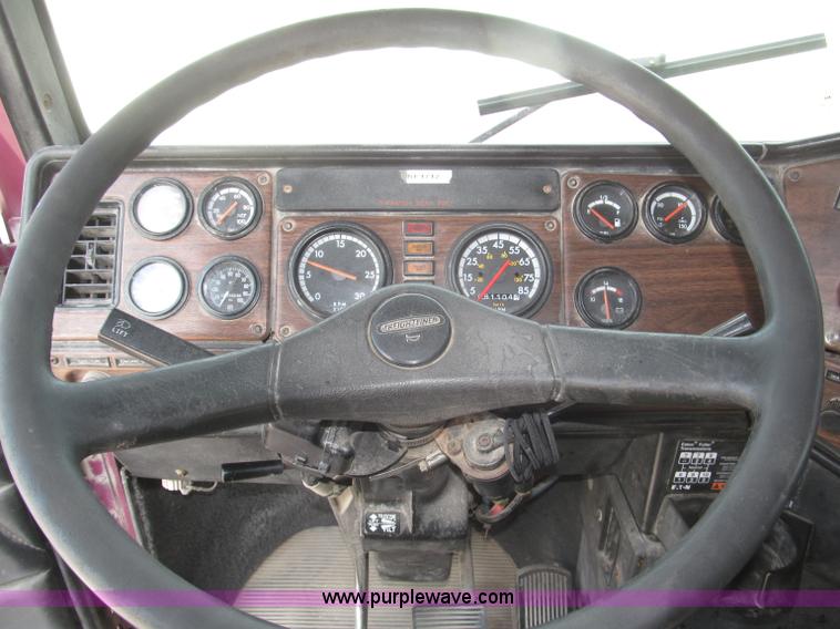 image for item F7111 2000 Freightliner FLD120SD tri axle dump truck