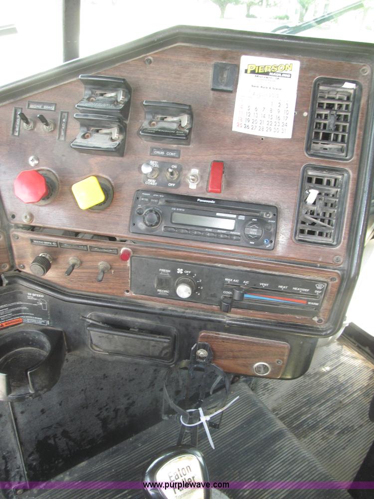 image for item F7111 2000 Freightliner FLD120SD tri axle dump truck