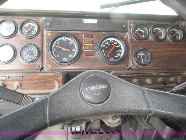 image for item F7111 2000 Freightliner FLD120SD tri axle dump truck