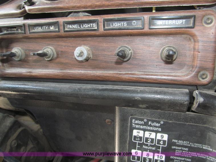 image for item F7111 2000 Freightliner FLD120SD tri axle dump truck