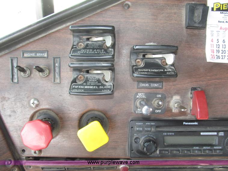 image for item F7111 2000 Freightliner FLD120SD tri axle dump truck