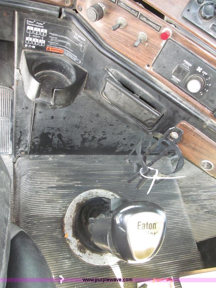 image for item F7111 2000 Freightliner FLD120SD tri axle dump truck