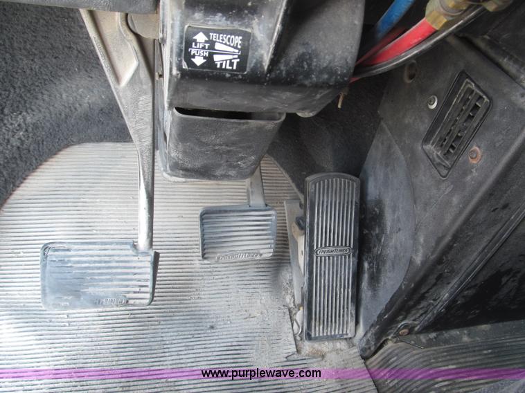 image for item F7111 2000 Freightliner FLD120SD tri axle dump truck