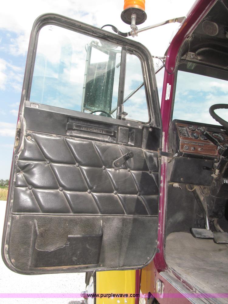 image for item F7111 2000 Freightliner FLD120SD tri axle dump truck