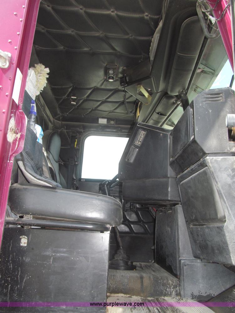 image for item F7111 2000 Freightliner FLD120SD tri axle dump truck