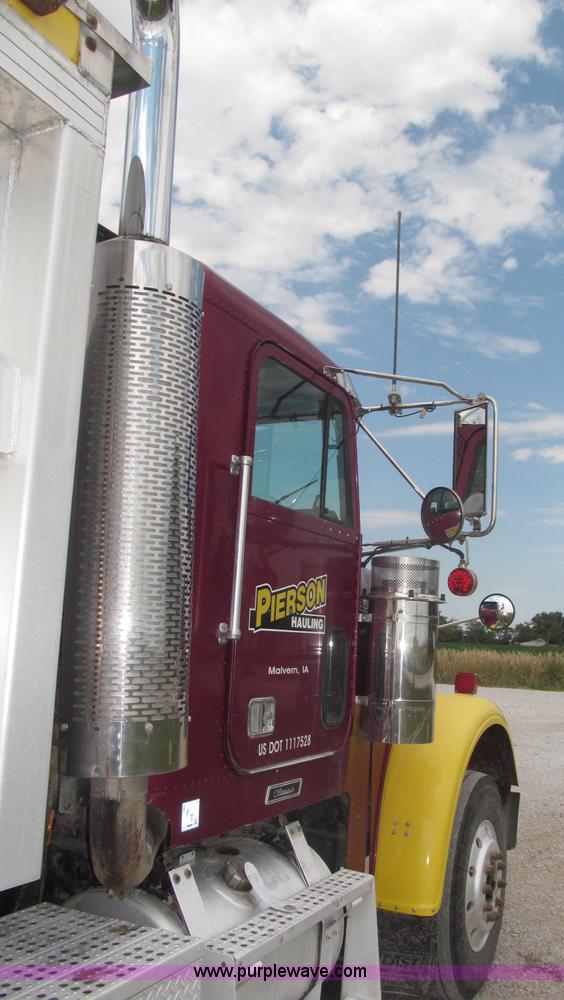 image for item F7111 2000 Freightliner FLD120SD tri axle dump truck