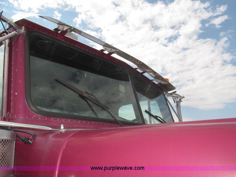 image for item F7111 2000 Freightliner FLD120SD tri axle dump truck